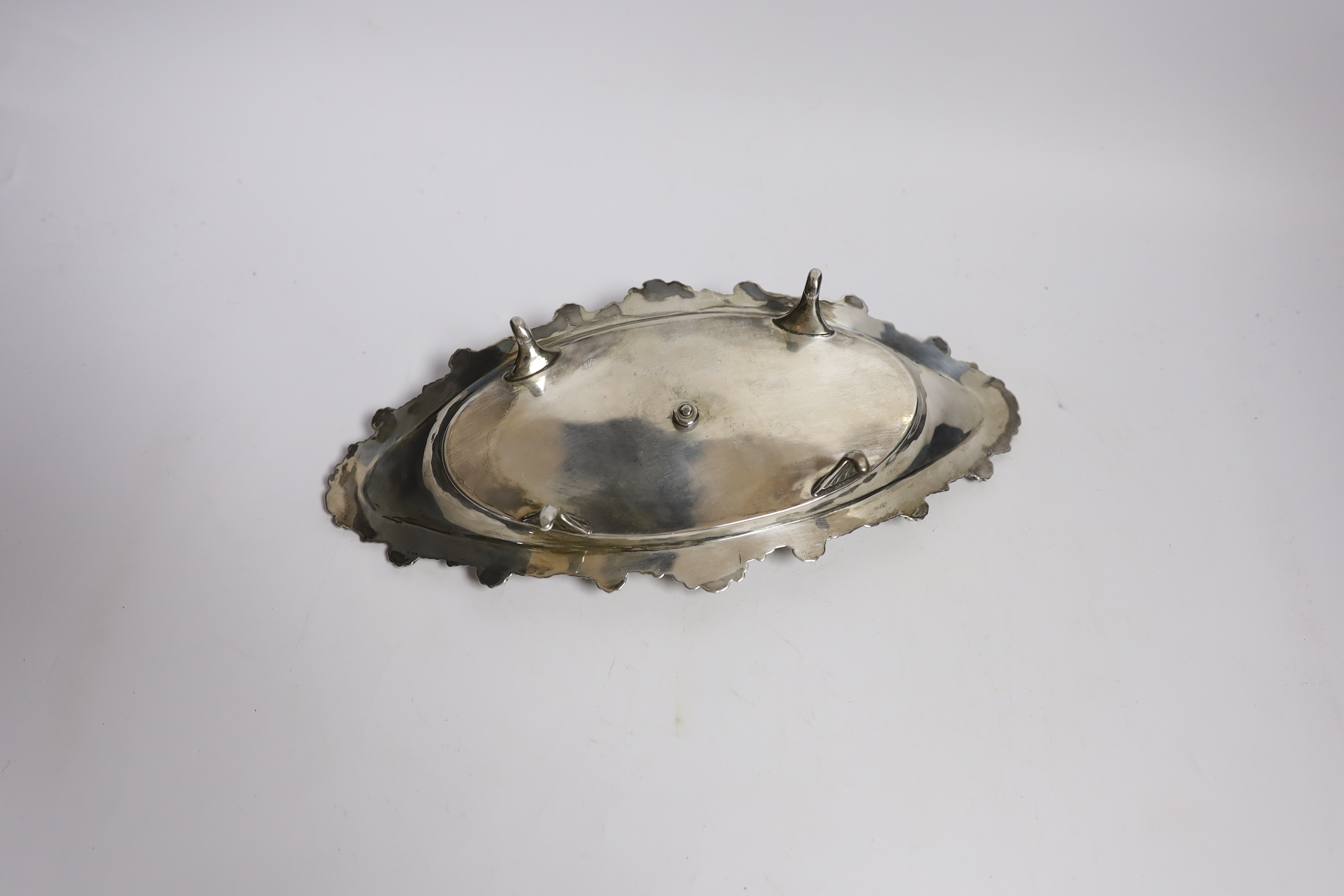 A late Victorian silver navette shaped inkstand, with silver mounted cut glass well, on four reeded feet, William Mammatt & Son, Sheffield, 1898, 27.7cm, 9.4oz.